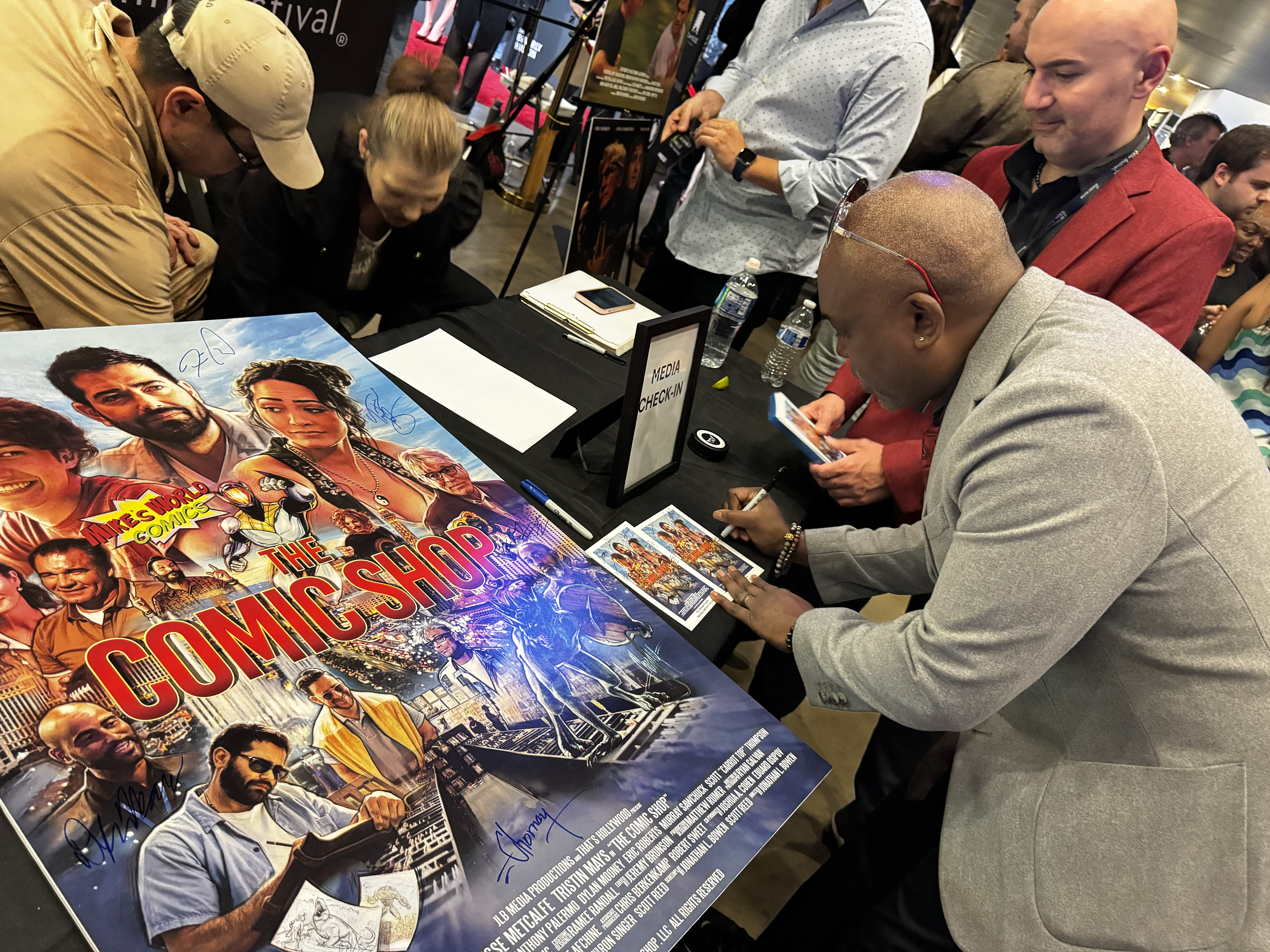 Kerwin Thompson Signs The Comic Shop Movie Poster